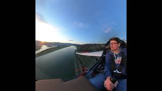 Glider midfield crossing and landing on RWY33 at Linz-Ost Airfield at beautiful sunset