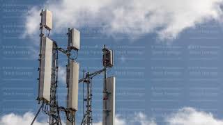 Telecommunication tower timelapse with white clouds and blue sky on a background. 3G, 4G and 5G Cell