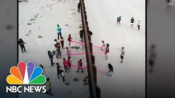 WATCH: Seesaws Allow Children From U.S. And Mexico To Play Across Border | NBC News
