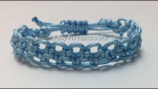 A openwork Bracelet from a light blue nylon cord for shamballa