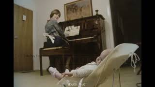 Mother Plays Piano for Her Baby, 1970s - Archive Film 1060623