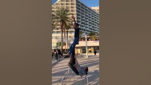 Guy Spins Swiftly on Top of Another Guy - 1125140-2