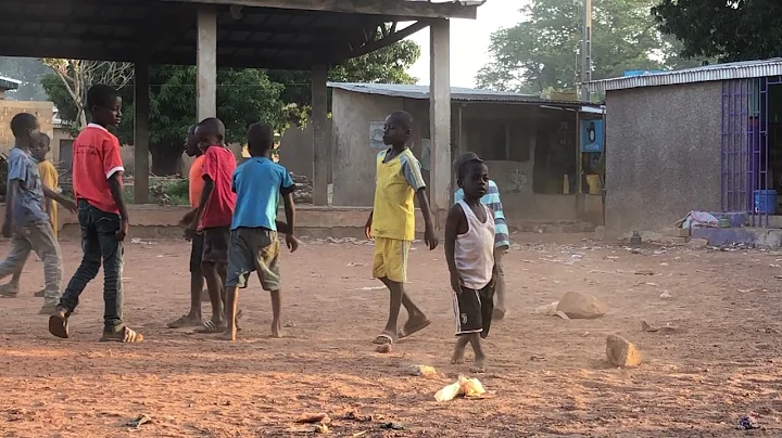 Cote d'Ivoire: Korhogo - kids playing in weaving v...