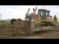 John Deere 1050C stripping topsoil