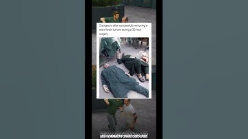 2 surgeons after successfully removing a set of brain tumors during a 32 hour surgery