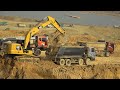 Caterpillar 320 Excavator Digging Soil Loading Into Dump Truck With Skill Operator