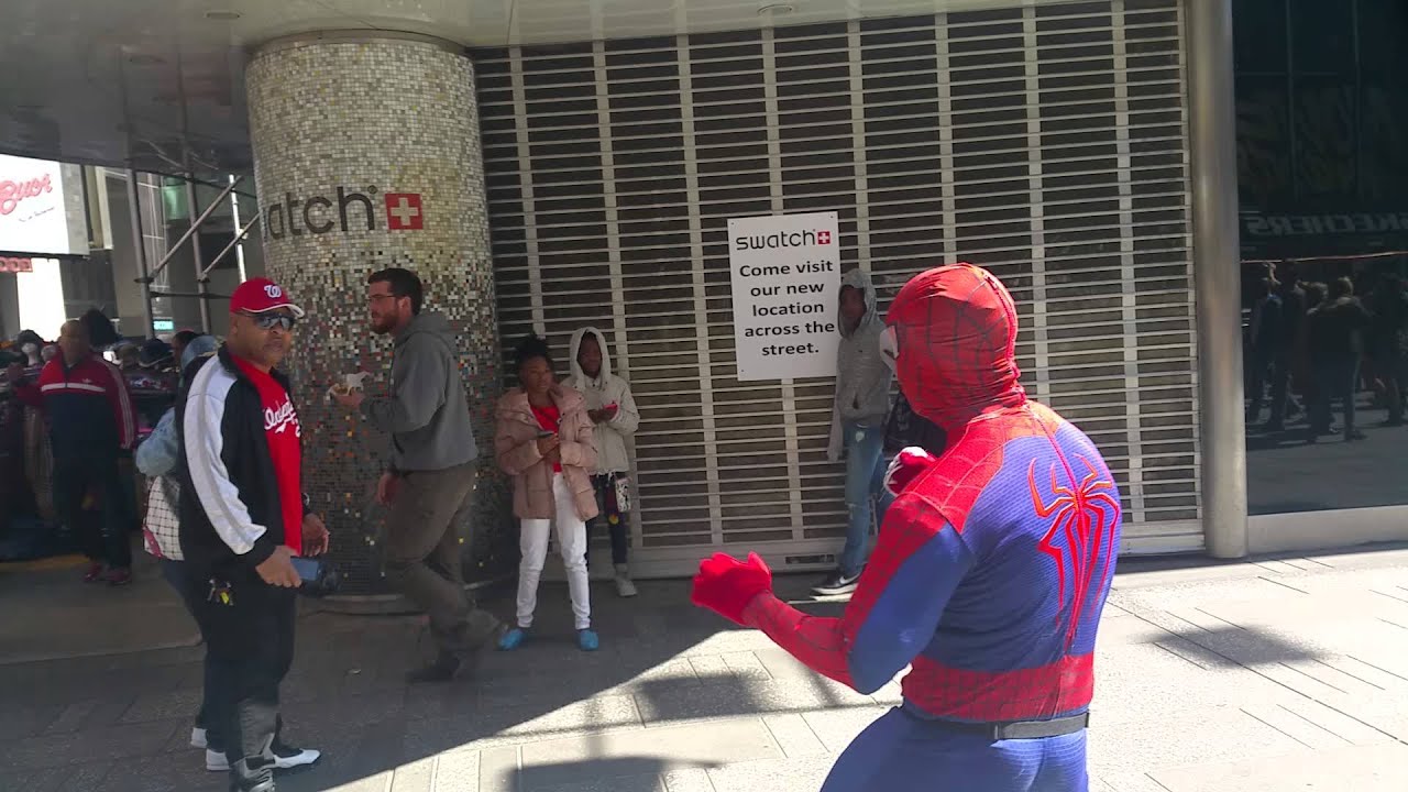 Man hit spiderman in times Square.