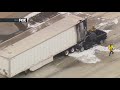 Truck crashes into semi on Cerritos Freeway, bursts into flames