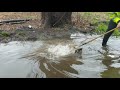 Draining flooded street with major amount of water current