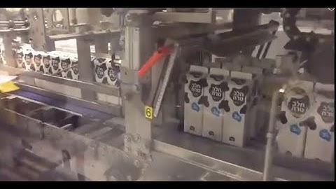 Dairy application   Prasmatic TCS 310W wrap around case packer and shrink wrapper by Robopac USA