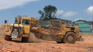 A Girl Driving a CAT 627 Scraper??  Awesome!