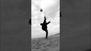 High kick football kick on the beach (black and white video) (2025)