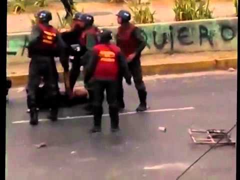 National Guard Beating a young student girl during protest in Valera, Venezuela.