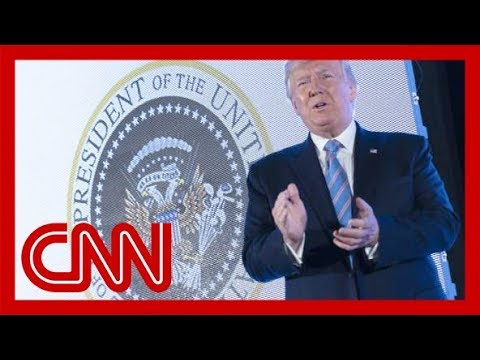 Aide fired after Trump appears with doctored presidential seal