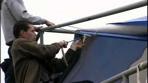 ChinookStalls.com - Step 8 Putting tarp on roof frame