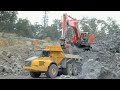 Hitachi 670 lch excavator load dump truck on coal mine area