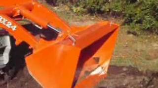 BXpanded Bucket Expander Moving a Dirt Pile