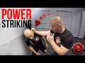 Powerful hammer fist strikes tritac martial arts training