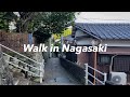 Walking through the streets of nagasaki  descending a sloping area of nagasaki