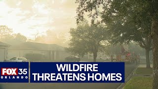 Kissimmee neighborhood evacuated as fire rips through woods