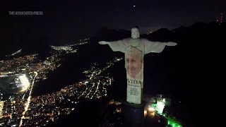 In Brazil the iconic Christ the Redeemer statue lights up to honour the Pope's new book