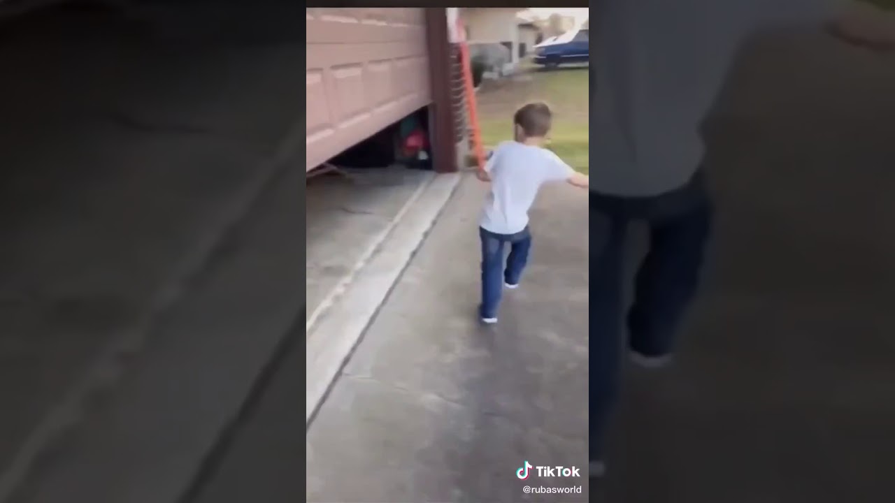 Little kid runs into garage door YouTube