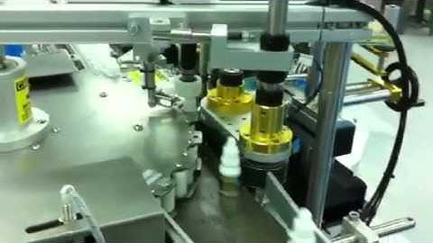 Indexing rotary wrap-around labelling