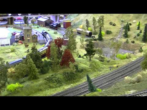 This is probably the longest Railworld Showcase video I have made as this one is nearly 43 minutes long. Well I am running some trains from my collection in this video which the first one is my Hornby Class 60 numbered as 60008 in the EWS livery working on a "Dreamliner" train which is eight MkIII carriages which are in Virgin Trains livery with the exception of the Hornby RFM Buffet Car which is in Wrexham & Shropshire livery and a Hornby MkIII DVT numbered as 82150 at the rear of the train also in Virgin Trains livery. Also it is running on the upper lever tracks as they are no longer DCC like I mentioned in the last video. I also brought along my Lima Class 59 numbered as 59201 "Vale of York" in National Power livery that I have reviewed in another video on my channel and the other model locomotive I had with me was my second Hornby Class 60 of eight that I own in my fleet that is 60078 in the Mainline blue livery with an EWS logo that I added in 2008 to this model from Fox Transfers. All the other trains shown in the video are from Railworld's "inhouse" fleet which are seen on the mainlines and rhe heritage line. The trains comprise of a LNER Class B12 Steam Locomotive hauling a Cream & Maroon rake of carriages. A Hornby Class 60 which this one is 60048 named as "Eastern" in EWS livery and a Bachmann Class 37 in BR Railfreight livery as both of these locomotives have sound although it has been disabled sadly as the CV volume has been turned right down. There is a Lima <b>...</b>