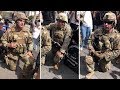 US National Guard members take the knee with protesters after Keke Palmer speech
