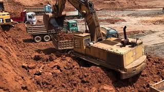 Caterpillar 245 Excavator Loading Mercedes And MAN Trucks