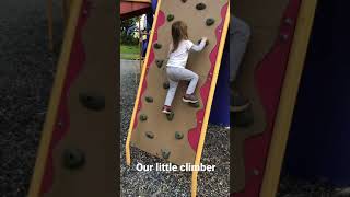 Mia climbing playground rock wall!