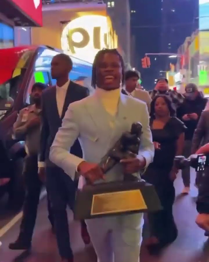 Travis took the Heisman trophy straight to Times Square ✨ (via @cubuffsfootball/IG)