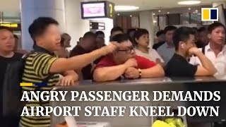Angry passenger demands airport staff kneel down after flight got delayed