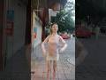 Shop owner stands outside of restaurant pretending she is a robot to attract new customers. #short