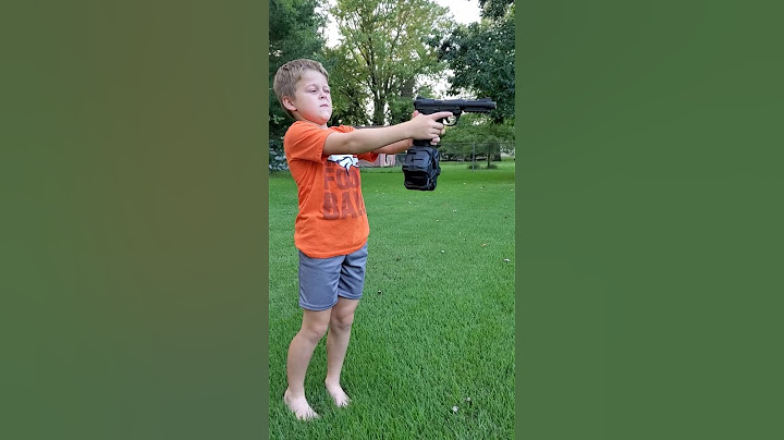 Kid shooting airsoft gun