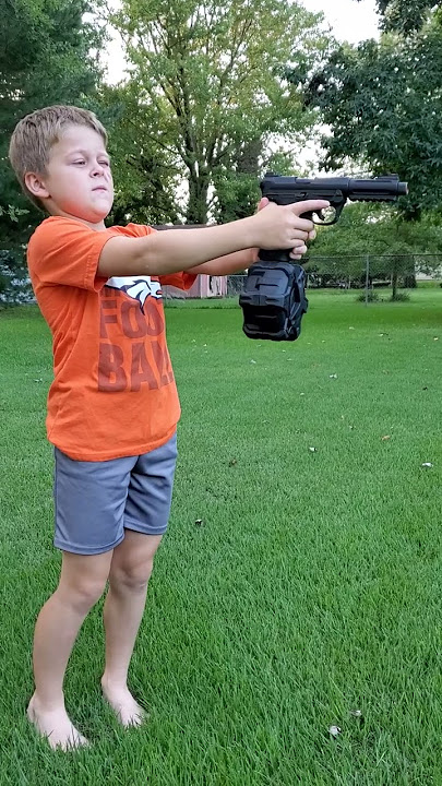 Kid shooting airsoft gun