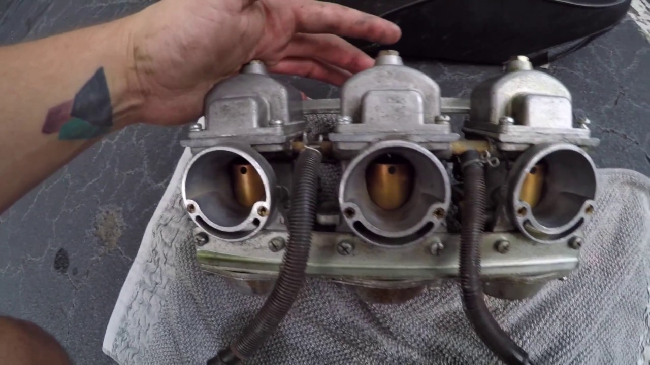 Taking off carburetor on a 3 cylinder motorcycle - YouTube