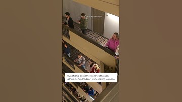 Thumbnail of US national anthem resonates through atrium as hundreds of students sing in unison