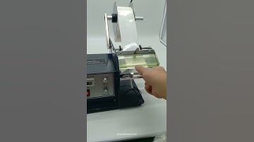 Desktop transparent clear label roll dispensing feeding machine label dispensing device video
