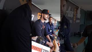 Kris Bryant speaks to the media in the dugout in his first day as a Giant.