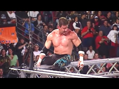 The late Eddie Guerrero executes a Frog Splash onto JBL