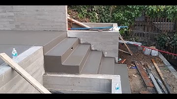 Veterans concrete,...finishing progress @ 2nd tier steps & slab / control joints