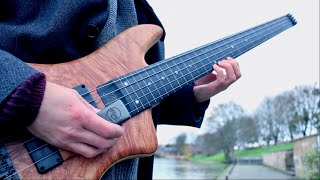 Christmas music on fretless bass and ebow sounds HEAVENLY