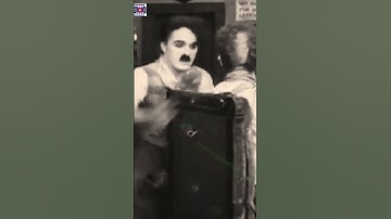 Charlie Chaplin is shaving the customer