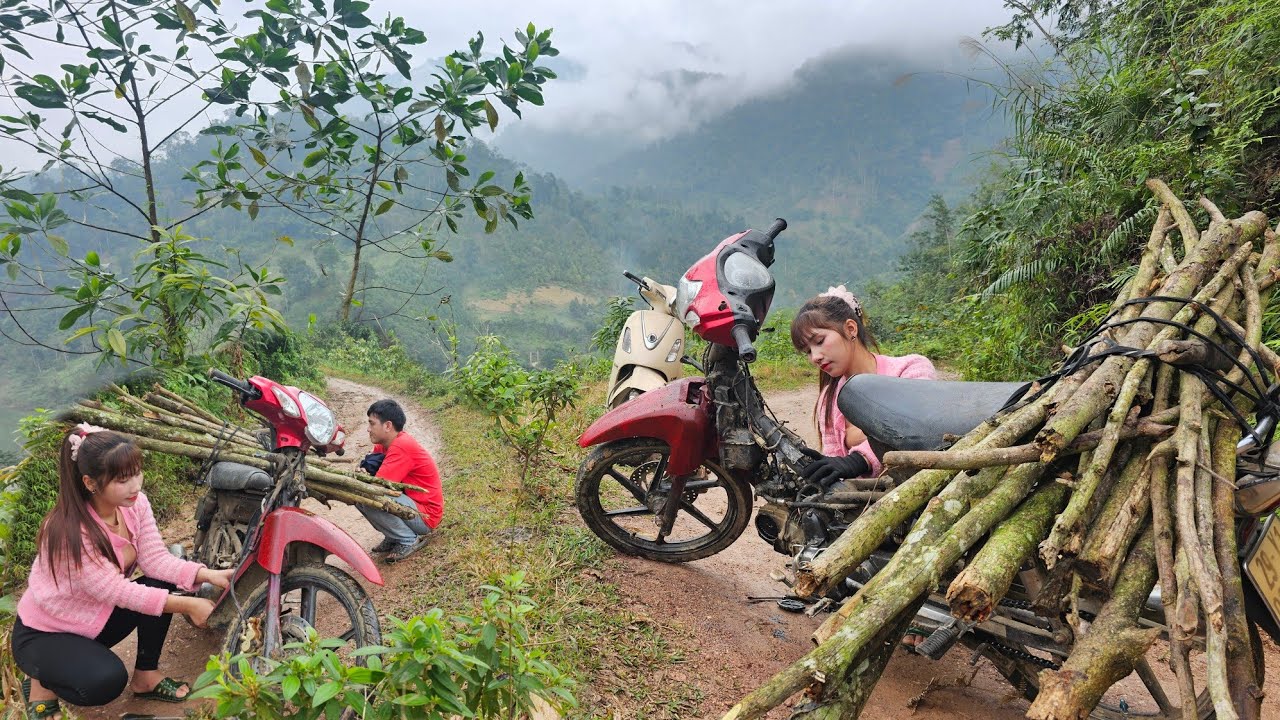 The girl rescued the woodcutter who fell off his motorbike on a hillside road.