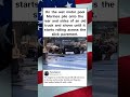 On the wet motor pool Marines pile onto the rear and sides of an old truck and shove #shorts