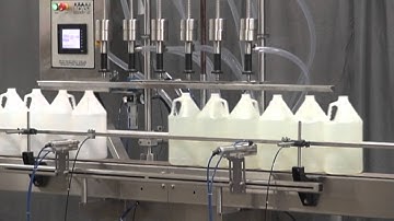 Overflow filler and inline capper model Trucap-6-Cent, filling Gallon containers, by Acasi Machinery