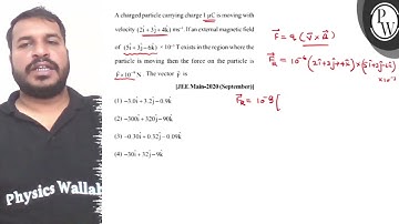A charged particle carrying charge \( 1 \mu \mathrm{C} \) is moving...