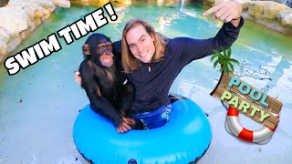 TEACHING BABY CHIMPANZEE HOW TO SWIM !