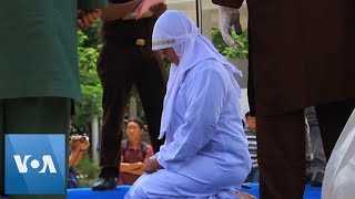 Indonesia Woman Collapses After Being Caned For Public Affection